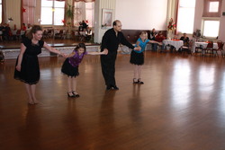 Breanna & Jocelyn dancing with teachers Gina & Jim at the Princess City Showcase